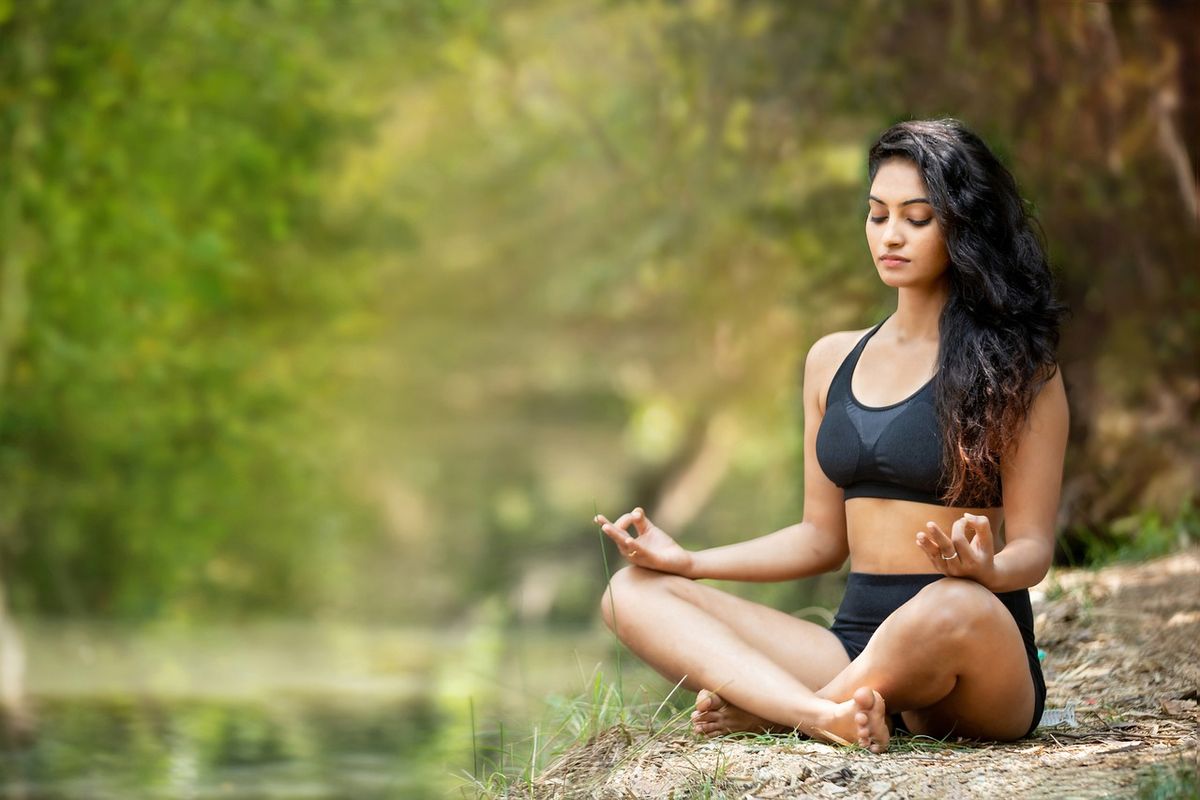 Female in Black Yoga Dress doing Yoga 