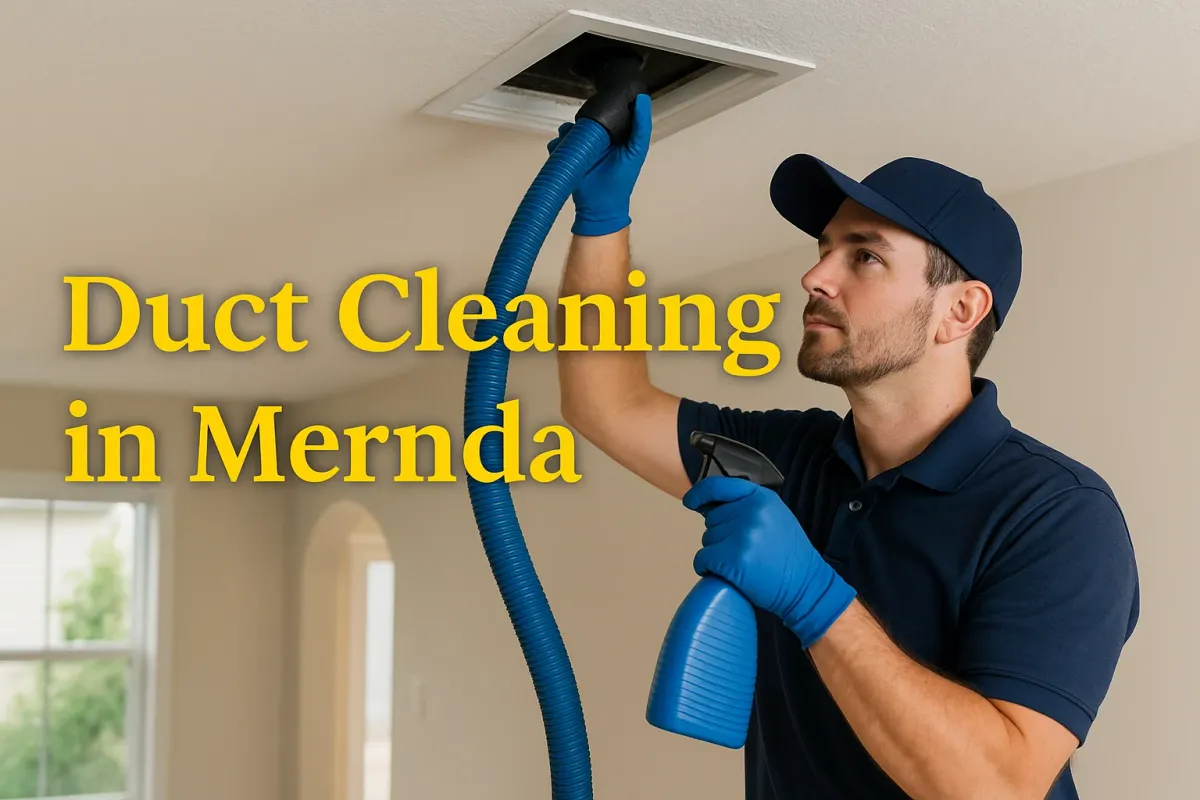 A professional technician in blue uniform cleans a ceiling air duct with a blue hose in a Mernda home