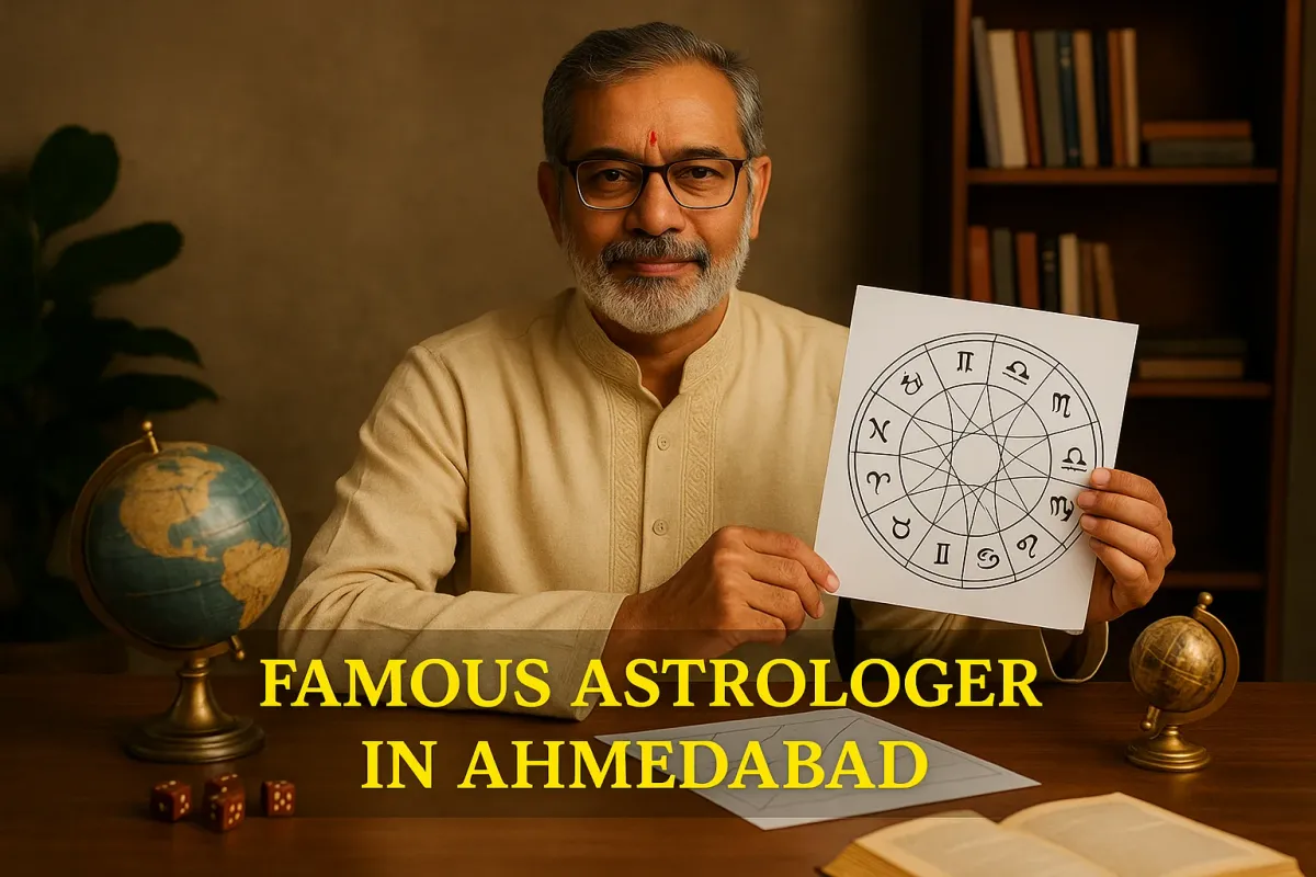 Indian astrologer in cream kurta holding zodiac chart at desk with globe and astrology tools in Ahmedabad setting.