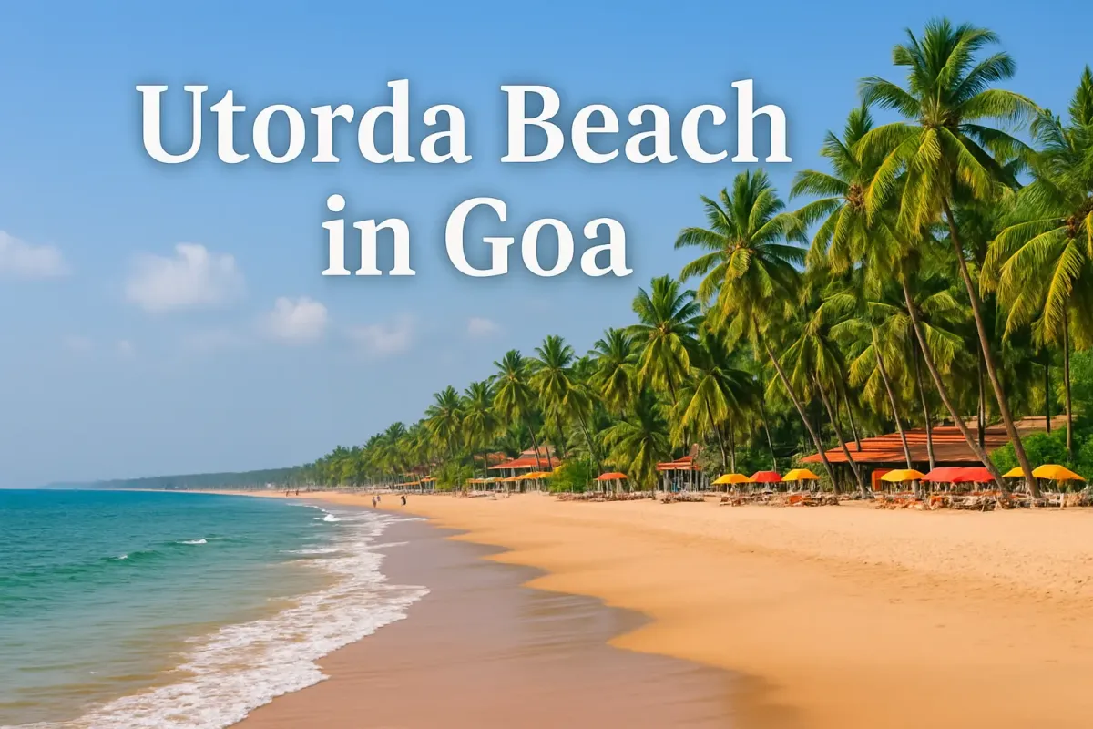 Colorful view of Utorda Beach in Goa with palm trees, golden sand, and vibrant beach umbrellas.